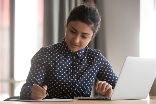 a woman using a job board software to post her new job listing